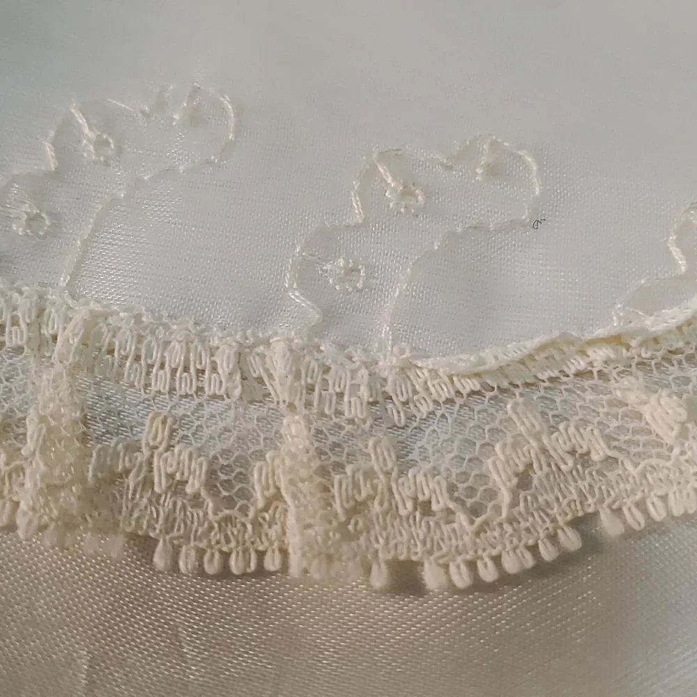 Vintage baby dress with jacket. Trimmed in lace with tie. The jacket has enbroid
